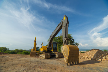 Yellow backhoe in construction area.