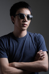 Fototapeta premium Asian man portrait with retro sunglasses