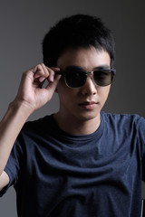 Asian man portrait with retro sunglasses