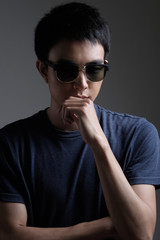 Asian man portrait with retro sunglasses