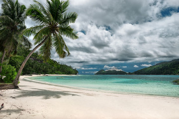 Untouched tropical beach, cloudy sky