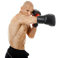 Fototapeta na wymiar Very fit kickboxer punching on white
