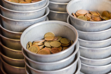 Coin donation to Thai temple