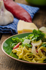 Tagliatelle with bacon, garlic and salad