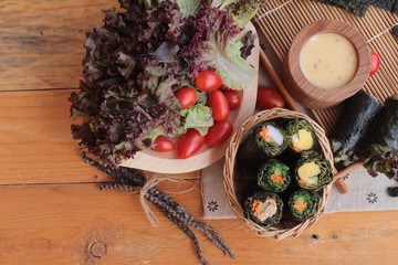 Vegetable salad wrapped with seaweed into spring rolls.