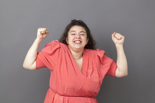extrovert 20s big woman expressing joy and success