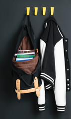 Backpack and jacket on the wall