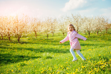 child running outdoors blossom trees. Art processing and retouch