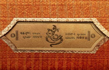 a traditional indian wedding invitation card - colorful, textured ,bold and beautiful well decorated