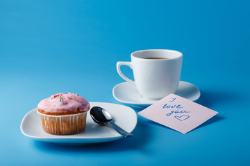 Colorful muffin on saucer