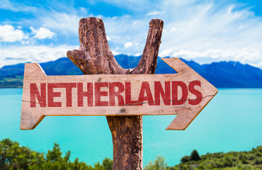 Netherlands wooden sign with river on background