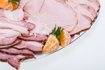 Plate of smoked meat isolated on white background