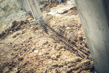 Foundation site of building, details and reinforcements with steel bars and wire rod, preparing for cement pouring