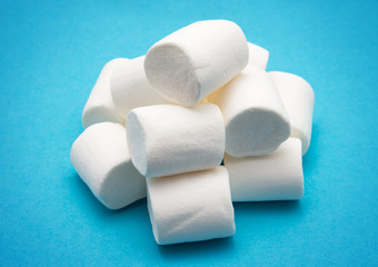 heap of marshmallow on blue