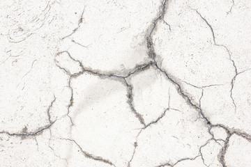 White plater painted and cracked. Grunge background.