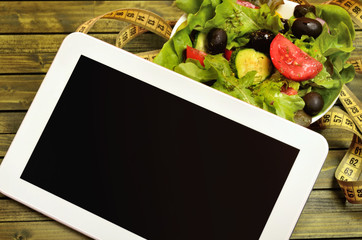 Tablet with vegetable salad