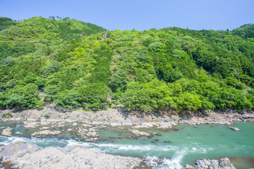 Fototapeta na wymiar Green mountain and river in summer season at Arashiyama , Kyoto
