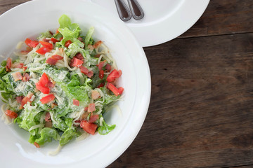 Tuna salad on white dish.