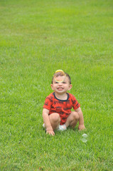 Toddler looking at a bubble