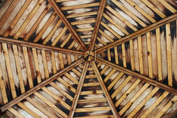 View of the wooden gazebo ceiling (wooden beam octagon of the gazebo ceiling)