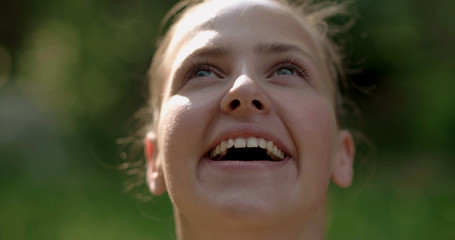 Girl placed in nature looking at the camera 