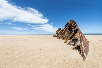 Famous Beach El Barco with rusty barge in Uruguay