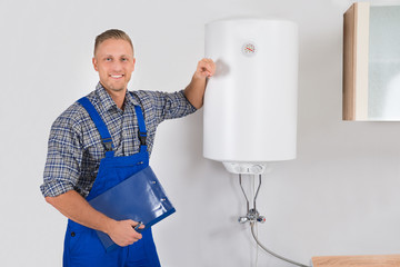Plumber Holding Clipboard And Pen