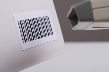 Person Hand Using A Barcode Scanner