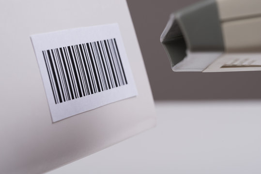 Person Hand Using A Barcode Scanner