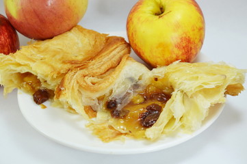apple pie and fresh apple on dish
