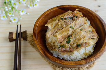 Salt and black pepper grilled pork with Japanese Rice in wooden