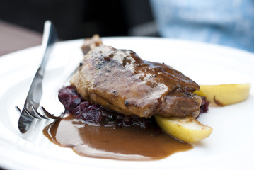 Duck Drumstick served with red cabbage and green apple