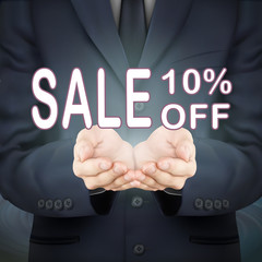 businessman holding sale 10 percent off words