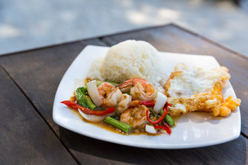 Rice topped with stir-fried shrimps and basil