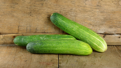 Fresh cucumber on the wooden background