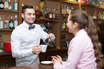 Fototapeta premium Young girl standing at bar.