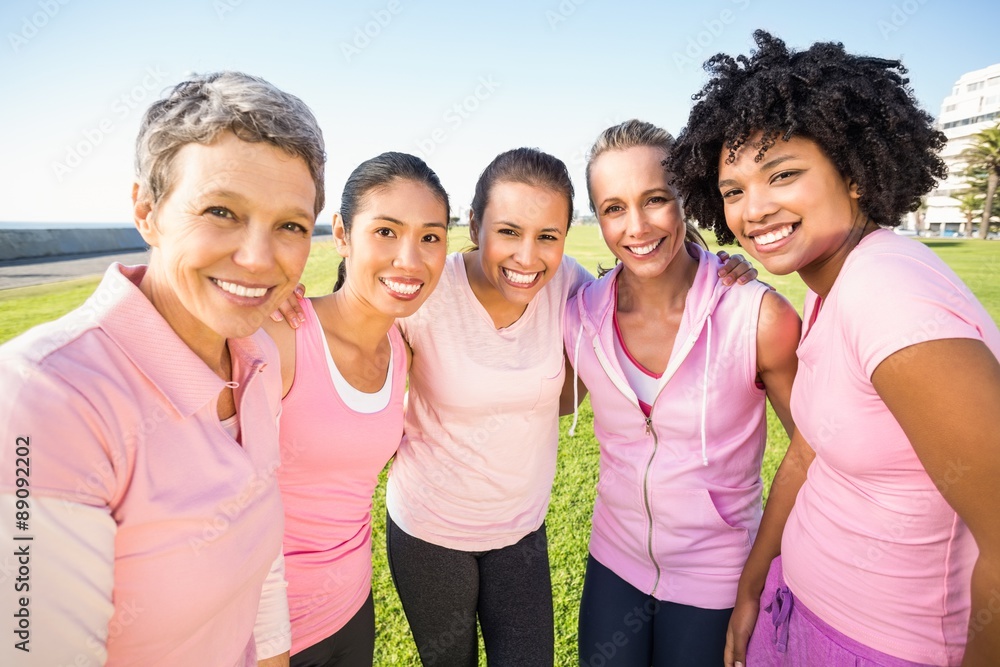 Wall mural Smiling women wearing pink for breast cancer