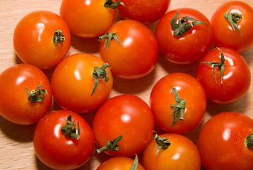 Red ripe tomatoes  on a wooden surface