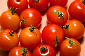 Red ripe tomatoes  on a wooden surface