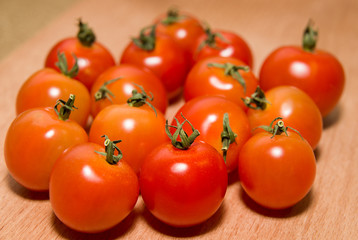 Red tomatoes  on a wooden surface