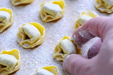 Preparing tortellini.