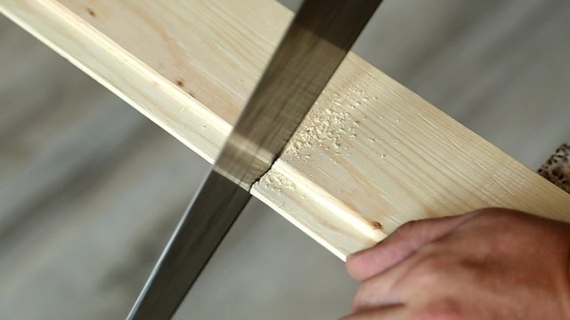 Carpenter sawing