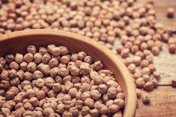 Close up of dried chickpeas in wooden bowl