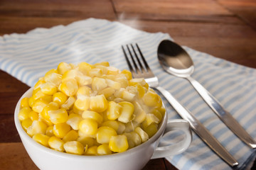 Sweet corn in a cup with smoke