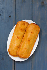 typical portuguese pie on plate on blue background