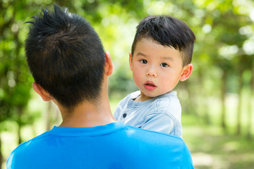 Little kid hugging with his dad