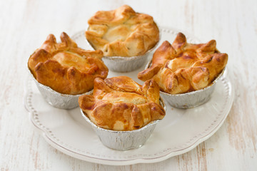 portuguese typical cookies empada de frango on white plate on white background