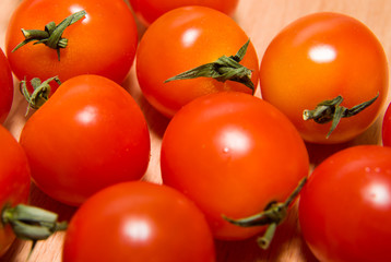 Red ripe tomatoes  on a wooden surface