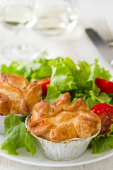 portuguese empada de galinha with salad