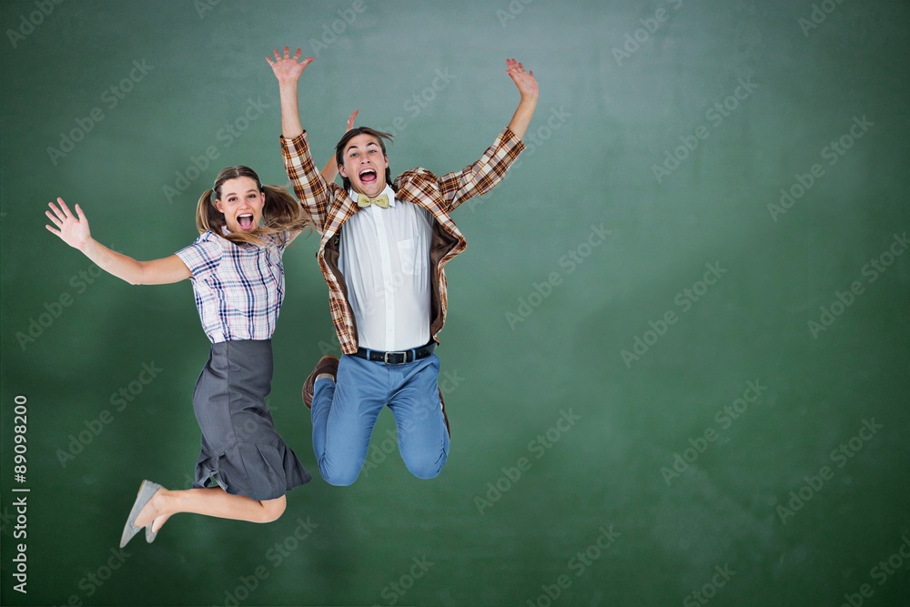 Poster composite image of geeky hipsters jumping and smiling